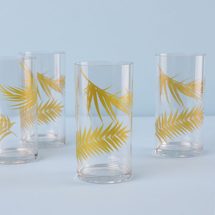 Set of four highball glasses with gold palm trees.