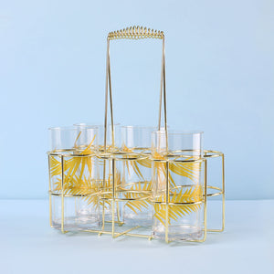 Gold metal bottle caddy with six slots.